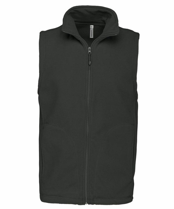 A black sleeveless vest with a front zipper closure, standing upright on a white background— the Kariban KB913.