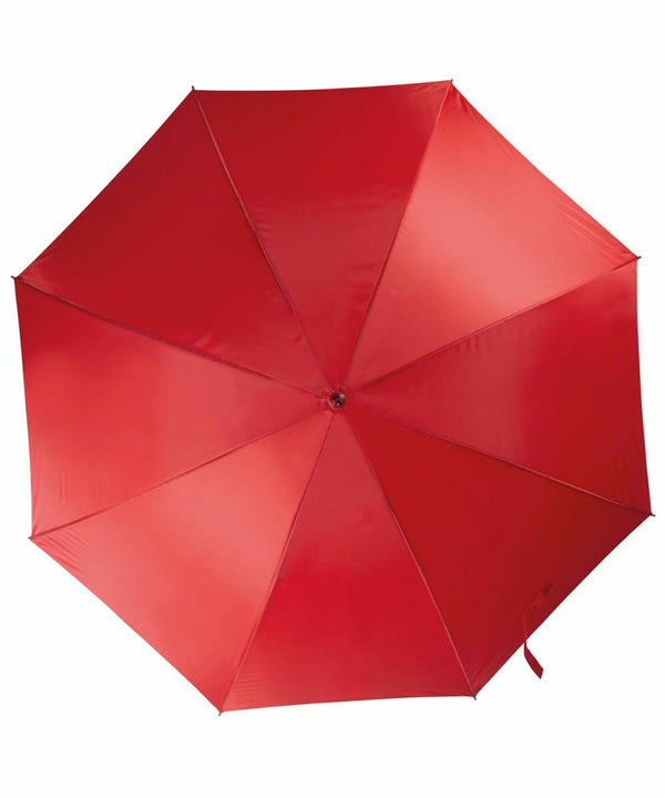 A red KiMood KI006 umbrella is fully opened, viewed from directly above. The image shows the umbrella's eight panels, with a small button at the center.