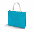 The KI011 jute tote bag by KiMood is displayed against a white background, featuring a plain turquoise color with short, light-colored handles. The bag has a structured shape and a smooth appearance.