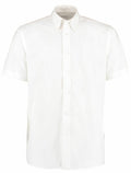 A Kustom Kit KK100 white short-sleeve button-up shirt with a collar, showcased against a plain background.