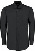A Kustom Kit KK104 long-sleeved black dress shirt featuring a front pocket and buttons.