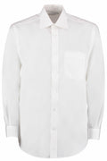 Product KK104 by Kustom Kit is a white, long-sleeved dress shirt featuring a front pocket and button closure. It boasts a classic collar and is showcased against a plain backdrop.
