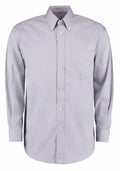 Introducing the KK105 by Kustom Kit: a light gray, long-sleeved button-down shirt featuring a stylish front pocket, buttoned cuffs, and a classic collar.