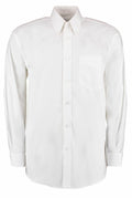 The KK105, a plain white long-sleeve button-up shirt from Kustom Kit, features a collar and a front chest pocket. It is displayed against a white background.