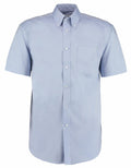 Introducing the KK109 by Kustom Kit: a light blue shirt featuring short sleeves, a button-up design, a button-down collar, and a chest pocket on the left side. The shirt is impeccably pressed and showcased against a white background.