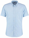 The KK183 by Kustom Kit is a light blue, short-sleeve button-up shirt featuring a chest pocket and a button-down collar.