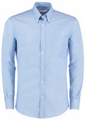 The KK184 by Kustom Kit is a light blue button-up shirt with a pocket on the left chest, featuring a button-down collar and long sleeves.