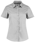 The KK241 by Kustom Kit is a gray short-sleeve, button-up shirt featuring a classic collar. It offers a tailored fit with a clean and simple design.