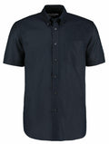 The KK350 by Kustom Kit is a short-sleeve, button-up dark green shirt featuring a chest pocket.