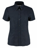 The KK360 by Kustom Kit is a black short-sleeve button-up shirt featuring a classic collar.