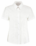 The KK360 by Kustom Kit is a timeless short-sleeve button-up shirt with a collar, presented on a plain white background. It boasts a classic design with front buttons and a tailored fit.
