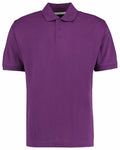 The Kustom Kit KK403 is a plain purple polo shirt featuring short sleeves, a collar, and a three-button placket, displayed on a white background.