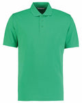 The Kustom Kit KK403 is a green polo shirt with short sleeves, a classic collar, and a three-button placket.