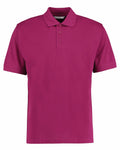 The KK403 by Kustom Kit is a magenta polo shirt featuring a classic collar and three buttons down the front. The shirt has short sleeves and boasts a simple, plain design.