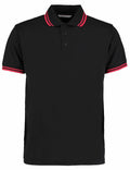 Kustom Kit's KK409 features a black polo shirt with red striped collar and sleeve edges.