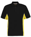Product: The Gamegear KK475 black polo shirt comes with a collar and three buttons. It is designed with vibrant yellow side panels separated by a thin white stripe from the main black sections, styled and laid flat on a white background.