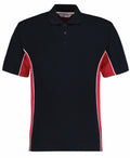 A Gamegear KK475 polo shirt featuring a black body, red sleeves, and white piping down the sides.