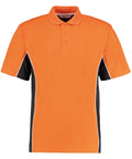 This is the Gamegear KK475 short-sleeved polo shirt, showcasing a vibrant orange color accented with a black side panel. It includes a classic collar, three-button placket, and white piping detailing along the seams of the side panels. The product is presented against a clean white background.