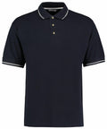 A plain black Kustom Kit KK606 polo shirt featuring short sleeves and a collar, with white trim on the edges of both the collar and sleeves, and three buttons down the front placket.