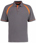 The KK615 polo shirt from Kustom Kit features a classic collar and a three-button placket, with orange accents on the shoulders and sleeves, set against a gray background.