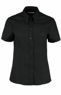 Kustom Kit's KK701 is a black short-sleeve button-up shirt featuring a pointed collar.