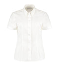 The KK701 by Kustom Kit is a crisp, short-sleeved white button-up shirt with a collar, neatly presented against a plain white background.