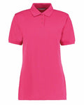 The KK703 by Kustom Kit is a bright pink polo shirt featuring short sleeves, a collar, and three buttons at the top.