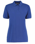 The KK703 polo shirt by Kustom Kit is a plain blue design with short sleeves and a collar. It features three buttons and is displayed against a white background.