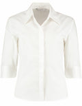 The Kustom Kit KK715, a women's white button-up shirt featuring three-quarter sleeves, is displayed against a plain background.