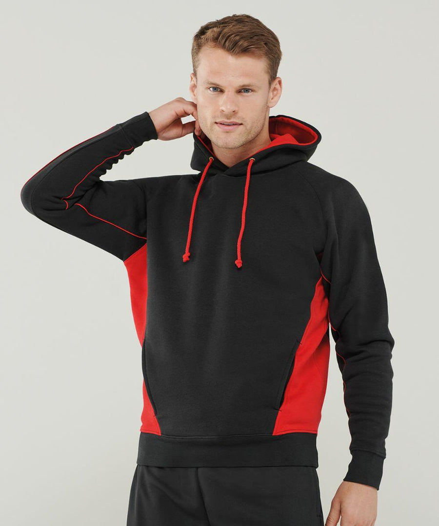 A man wearing a black and red Finden & Hales LV335, standing against a plain background, with one hand raised to the back of his head.