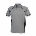 The LV370 polo shirt by Finden & Hales is gray with black piping along the seams and a button-up collar. It features black side panels, short sleeves, and is displayed against a plain white background.