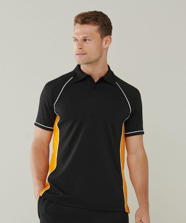 A person wearing a black Finden & Hales LV370 shirt with yellow side panels and white piping stands against a plain background, looking to the left.