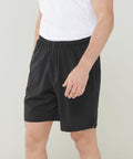A person wearing a white shirt and Finden & Hales LV817 black athletic shorts. The individual is partially cropped out of the frame.