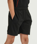 Person wearing black athletic shorts (Finden & Hales LV887) with hands in pockets.