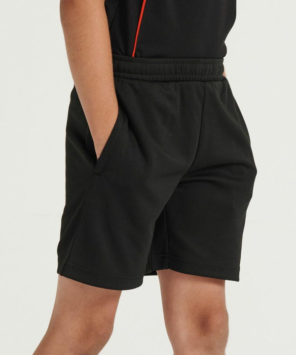 Person wearing black athletic shorts (Finden & Hales LV887) with hands in pockets.