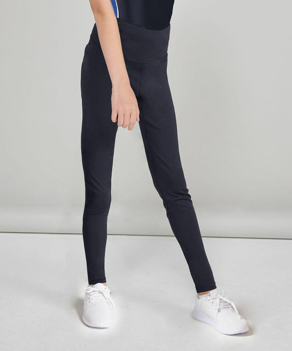 Person wearing black leggings and Finden & Hales LV897 white sneakers, standing against a plain gray background. Seen from the waist down.