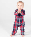 A toddler in a red and blue plaid Larkwood LW74T onesie stands on a white background, clapping their hands.