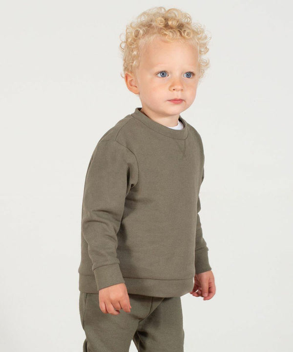 A young child with curly blond hair is standing and wearing a matching olive-green long-sleeve shirt and pants from Larkwood's LW800. The background is plain white.