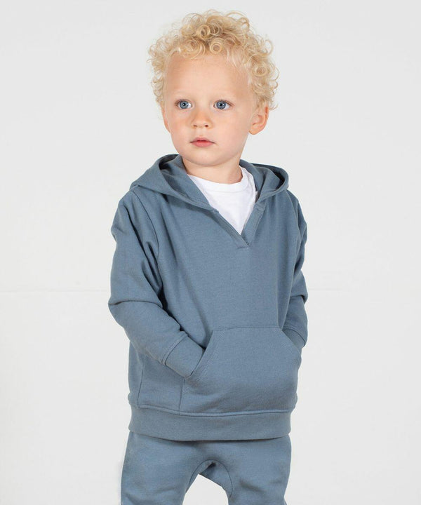 A young child with curly blond hair and blue eyes wears a light blue LW802 hoodie and matching pants by Larkwood, standing against a plain white background.