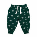 Larkwood LW85T children's sweatpants are green with white snowflake patterns and a white drawstring.