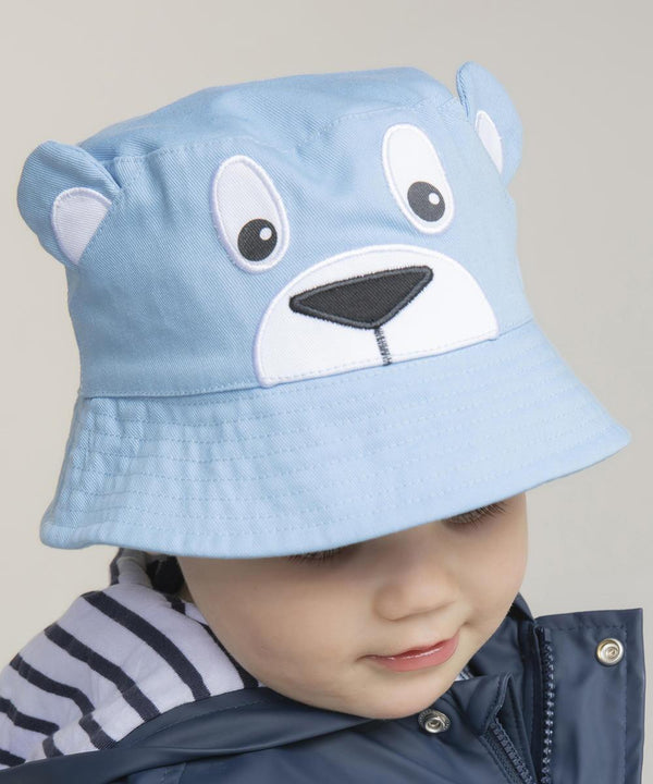 A young child in a Larkwood Character bucket hat featuring a bear face and ears, looking down. The child also wears a navy jacket over a white and navy striped hoodie.