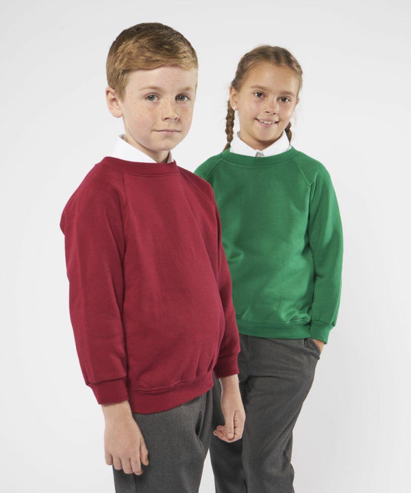 Two children, one wearing a red sweatshirt and the other wearing a green sweatshirt, stand side by side, both wearing Maddins MD01B white shirts and grey trousers.