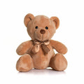 A brown teddy bear from Mumbles, model MM032, featuring a polka dot bow tie, is sitting upright and facing forward against a plain white background.