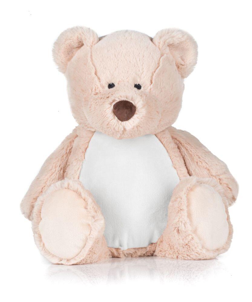A plush teddy bear from Mumbles, identified as product MM051, featuring a light beige body and white belly, is sitting upright on a reflective surface.