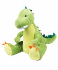 A Mumbles MM053 with orange spikes on its feet and tail, and white felt teeth, sitting upright.
