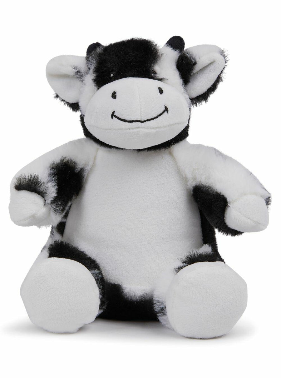The MM060 from Mumbles is a plush toy styled as a smiling cow, featuring black and white patterned fur. It sits upright with its arms slightly outstretched.