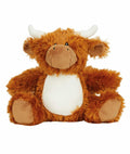 The Mumbles MM060 is a plush toy that looks like a Highland cow, featuring shaggy orange-brown fur with white patches on its face and belly. It has small black eyes, two curved horns, round ears, and a friendly expression while sitting upright against a plain white background.