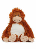 The plush MM060 orangutan from Mumbles features shaggy orange fur with a white belly and sits facing forward. It sports a friendly expression with a stitched smile and round eyes, while its arms and legs are light beige.