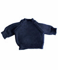 A dark blue Mumbles MM083 knitted sweater with long sleeves and a ribbed neckline, cuffs, and hem, laid flat against a white background.
