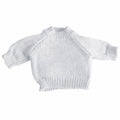 The Mumbles MM083 is a plain white knitted baby sweater featuring long sleeves and ribbed details on the collar, cuffs, and hem.
